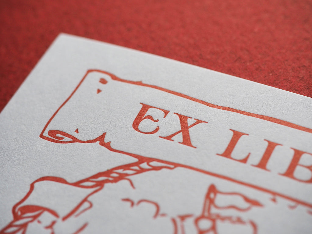 Close up of letterpress bookplate ex libris red 
