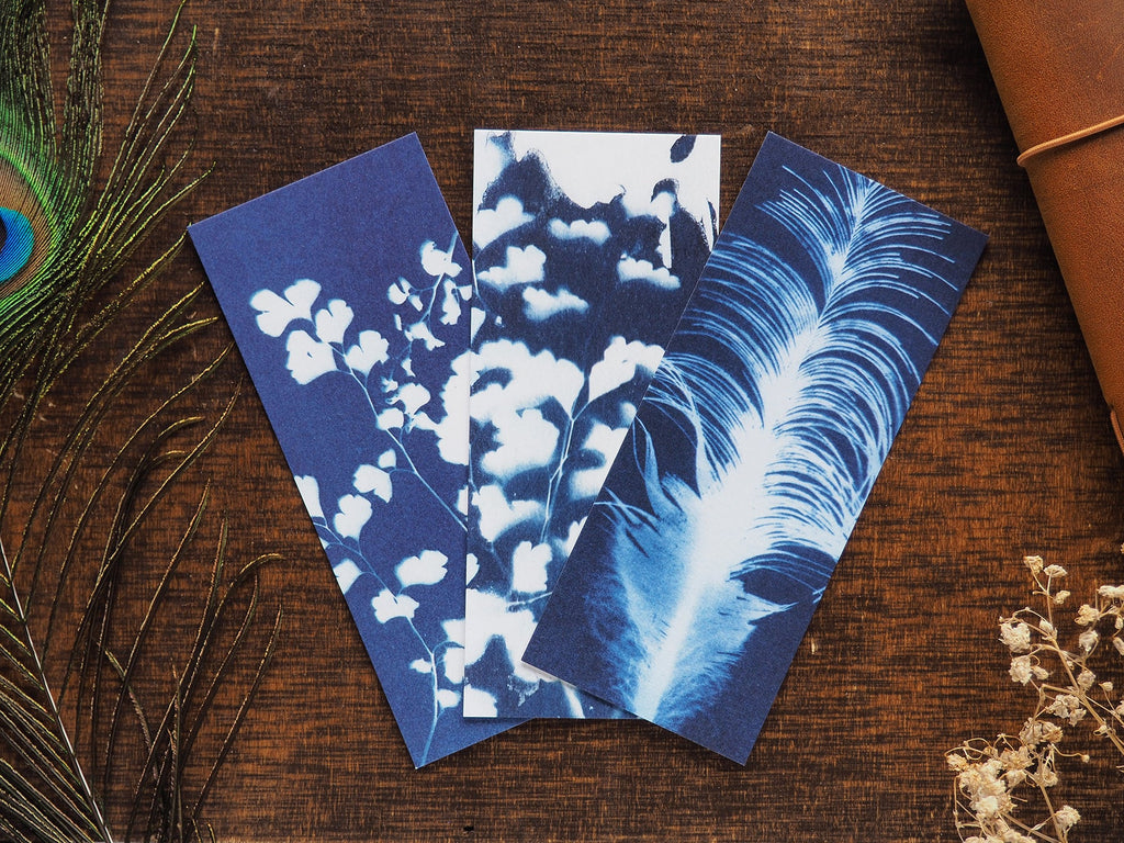 Set of 3 cyanotype bookmarks flaylay on a desk