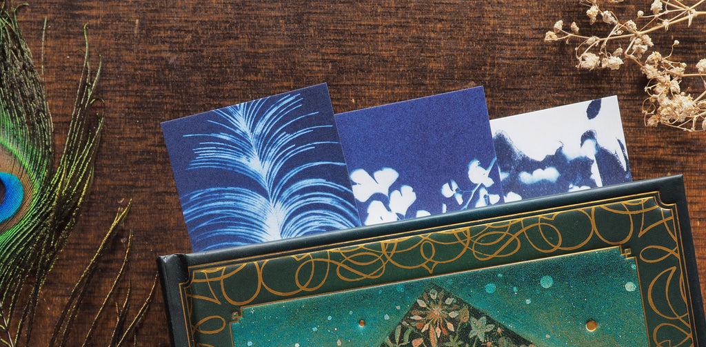 decorative bookmarks in vintage book on brown table and various flower and peacock decorations