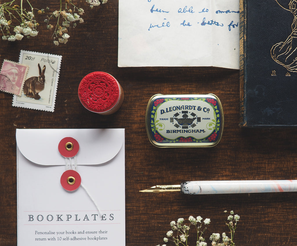 vintage styled desk with stamps, postage stamp, pen and nib, vintage books and bookplate pack