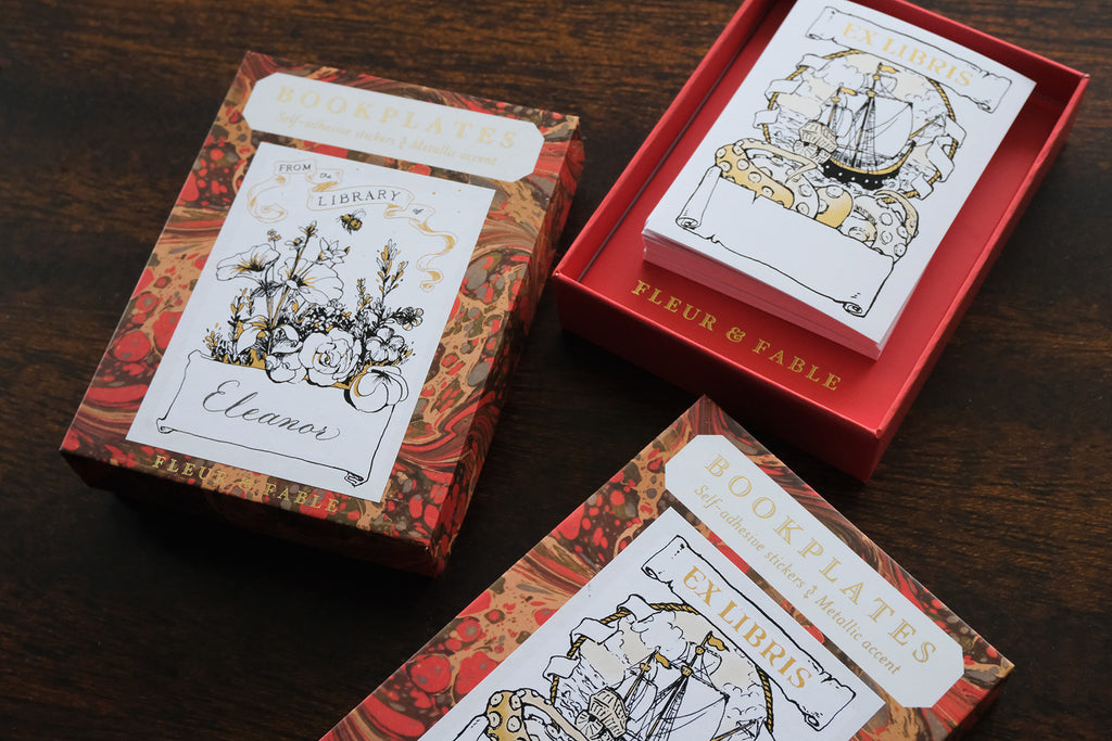 A selection of bookplate gift boxes with one open