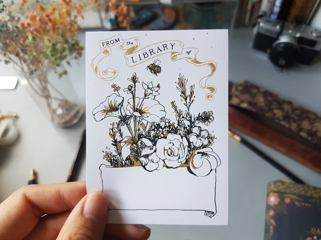 Hand holding English Garden bookplate sticker