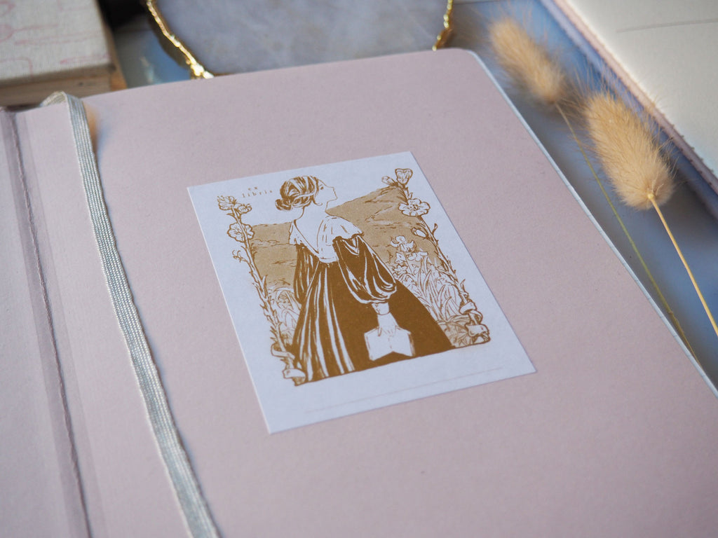 Jane bookplate sticker stuck in a book angled shot