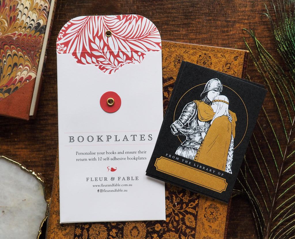 Bookplate packaging and Knight's Goodbye bookplate stickers flatlay on a desk