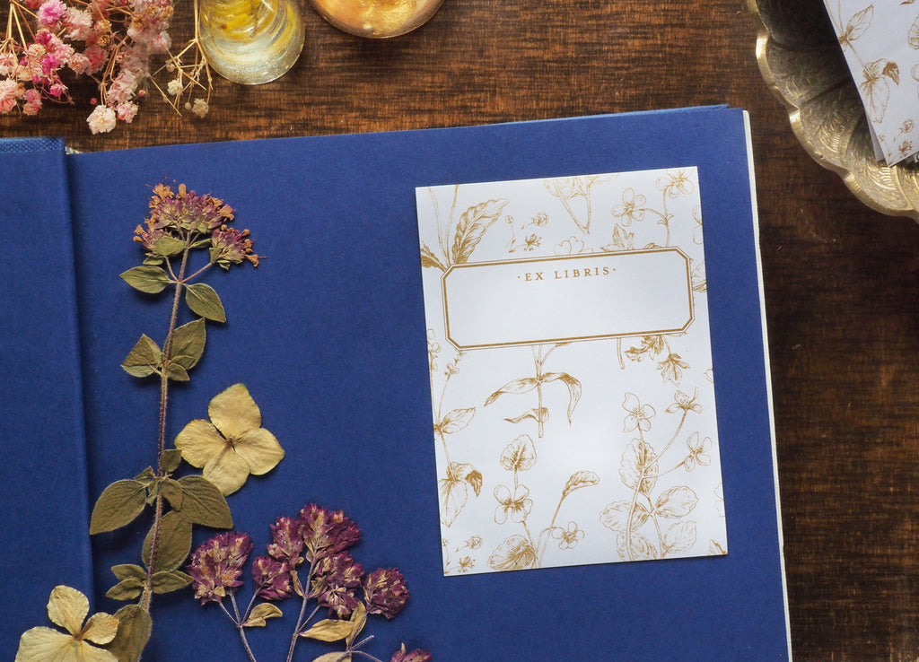 Millefleur bookplate design on blue book ex libris flowers