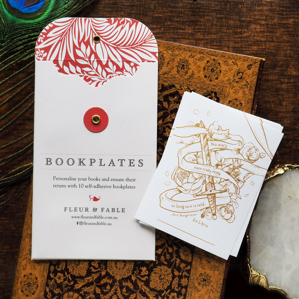Bookplate packaging and Shadowsteel bookplate stickers flatlay on a desk