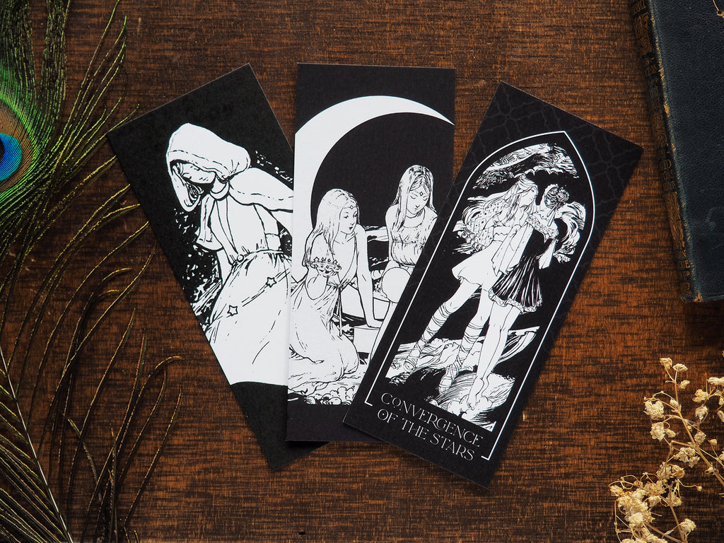 Set of 3 illustrated Starcatchers bookmarks flaylay on a desk