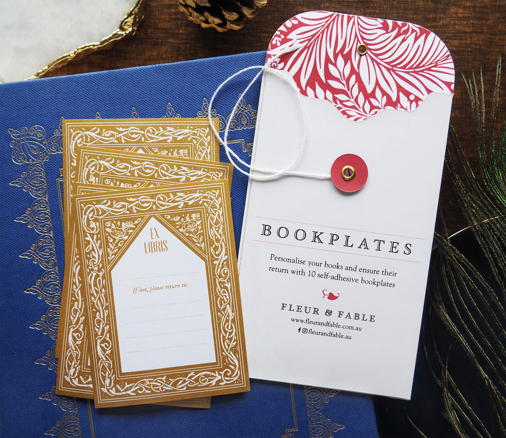 Bookplate packaging and Tangled Vines bookplate stickers flatlay on a desk