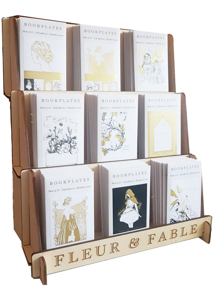 Wooden tiered display of bookplates Fleur & Fable branded stand