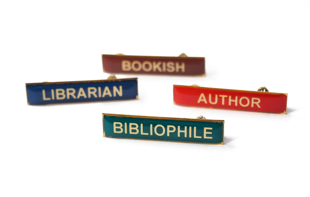 various enamel title badges bibliophile, author, librarian, bookish
