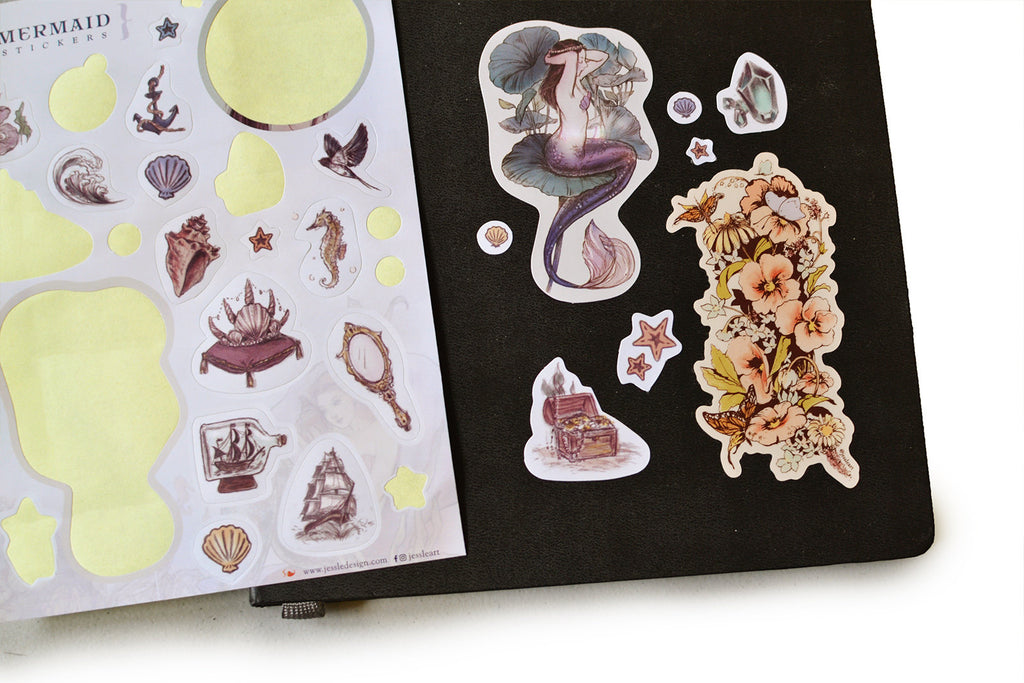 Sticker sheet with several stickers placed on the cover of a book