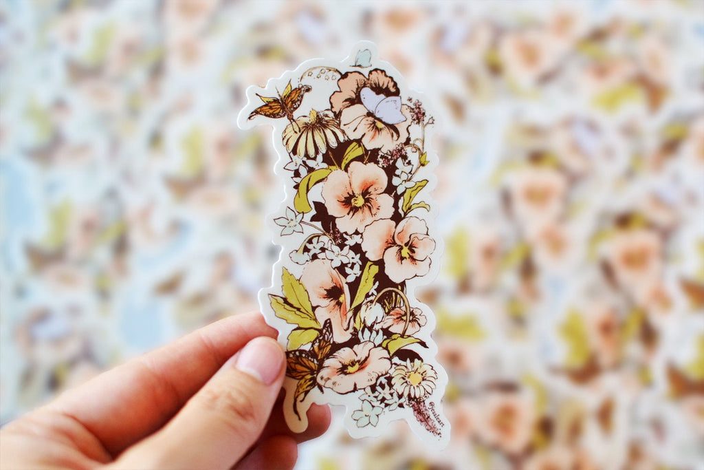 Hand holding illustrated floral vinyl sticker